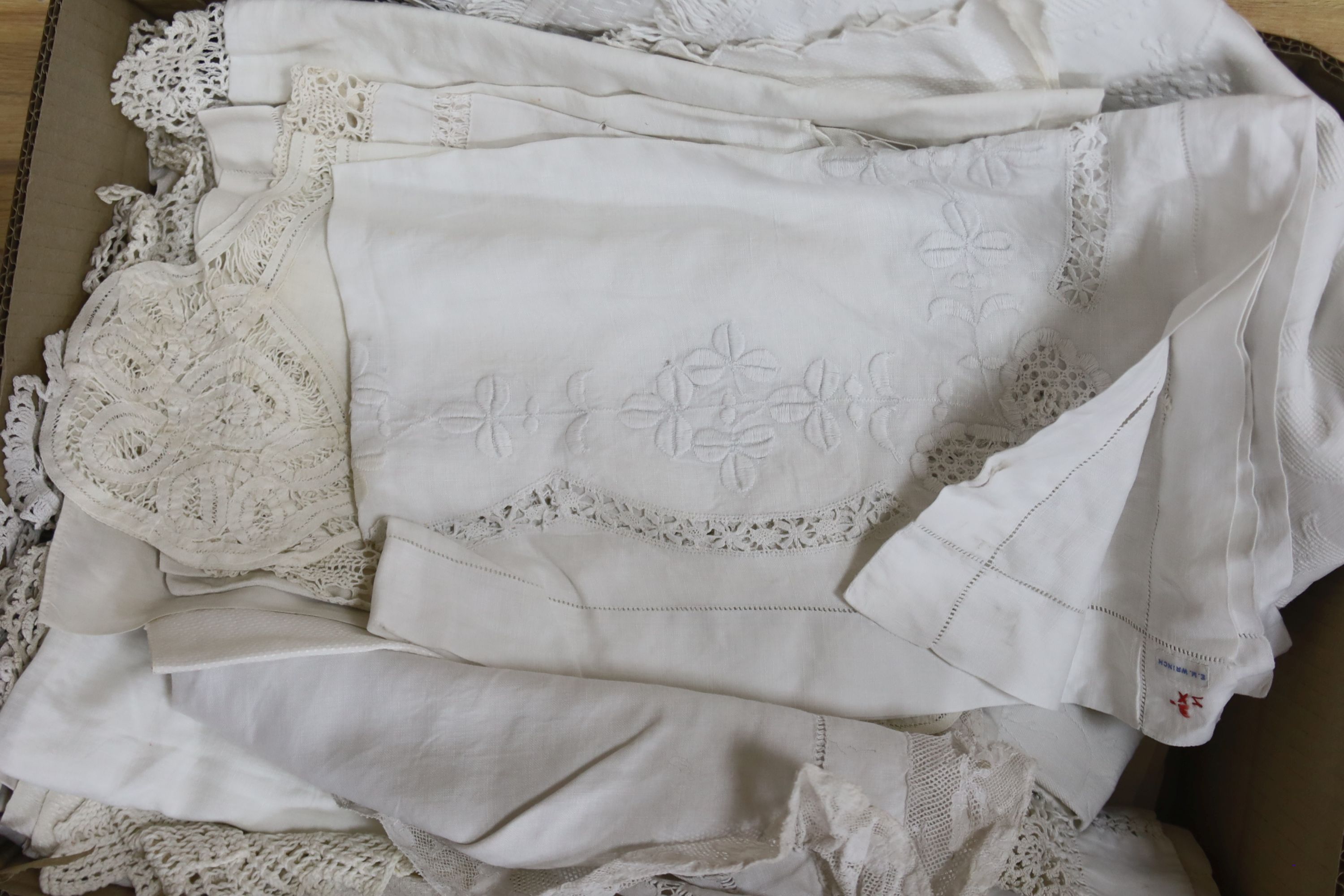 A large collection of table linen including drawn thread work, tape lace, cutwork and crochet cloths, mats. etc